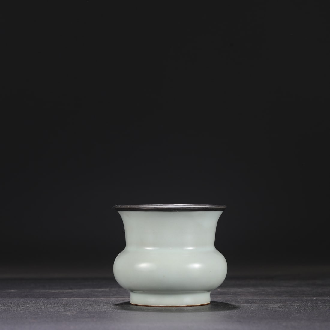 A Southern Song Dynasty official kiln celadon-glazed silver-rimmed spittoon, formerly in the (1 of 7)