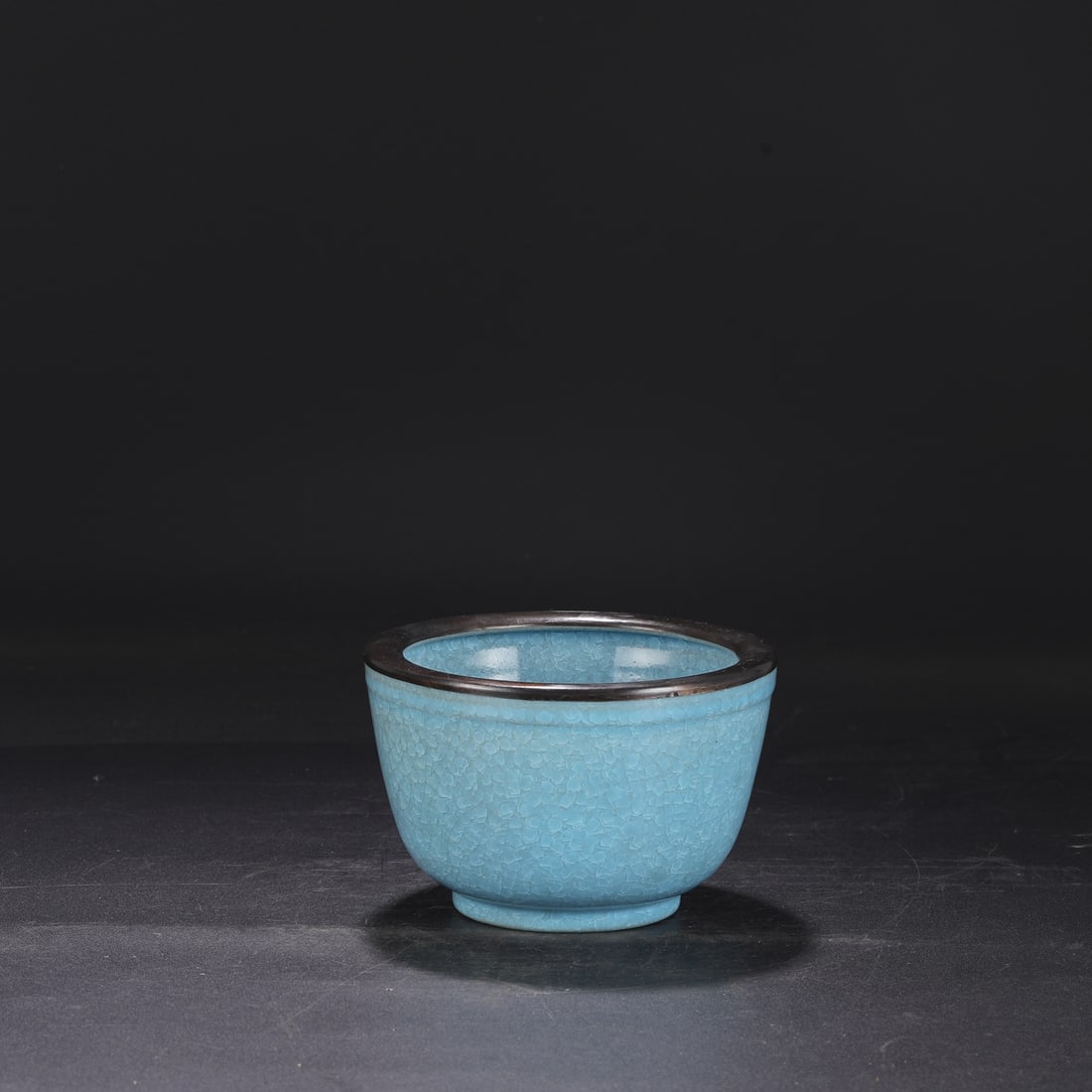 A Northern Song Dynasty Ru ware sky-blue glazed, ice-crack pattern, silver-rimmed, deep-bodied (1 of 7)