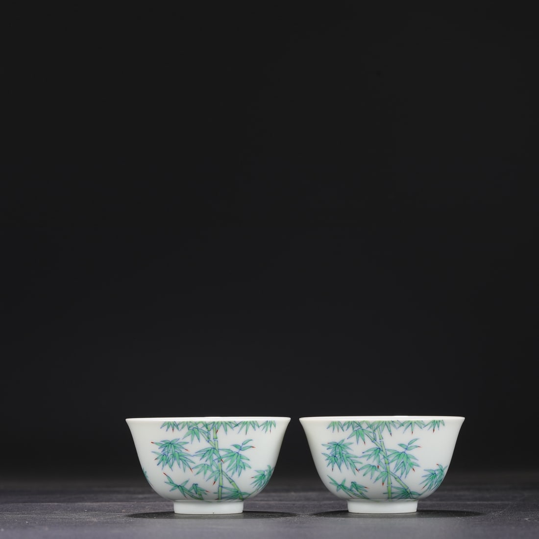 A pair of Qing Dynasty Yongzheng Doucai Bamboo and Peace Pattern Cups (formerly in the collection).: Dimensions: Height 5 cm, Mouth Diameter 9 cm