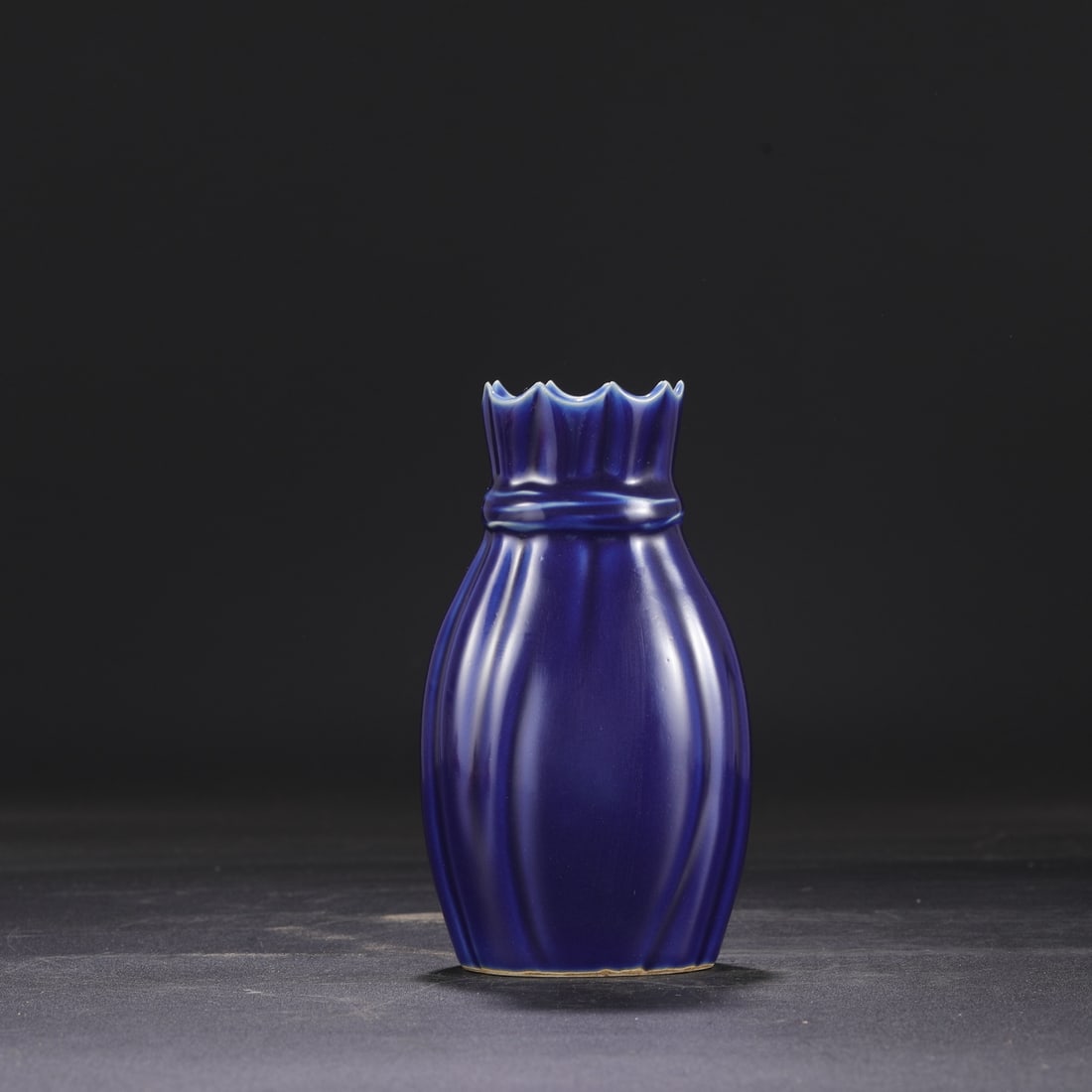 A Qing Dynasty Kangxi period celadon-glazed parquet vase from a collection.: Dimensions: Height 18 cm, Mouth diameter 6 cm, Belly diameter 10 cm.