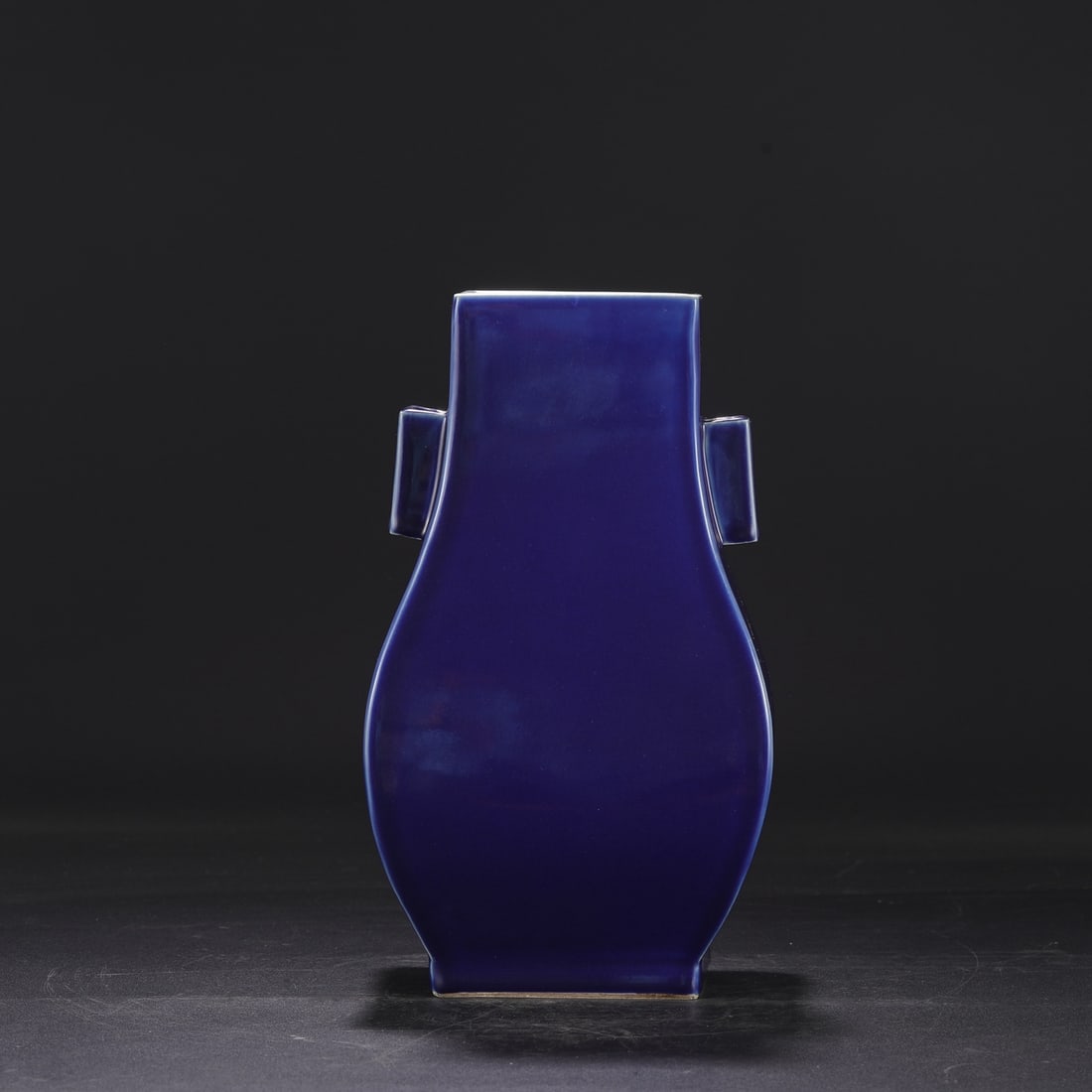 A Qing Dynasty Kangxi period celadon-glazed large vase with pierced handles. (1 of 8)