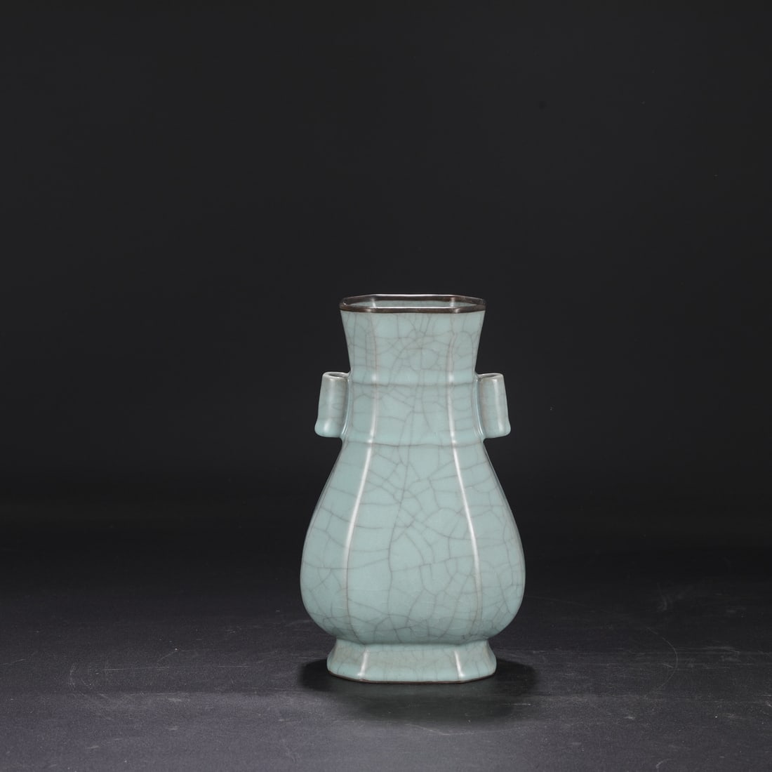 A Southern Song Dynasty official kiln celadon vase with a silver rim, used in the imperial court,: Dimensions: Height 25 cm, Mouth diameter 9.5 cm, Belly diameter 14 cm.