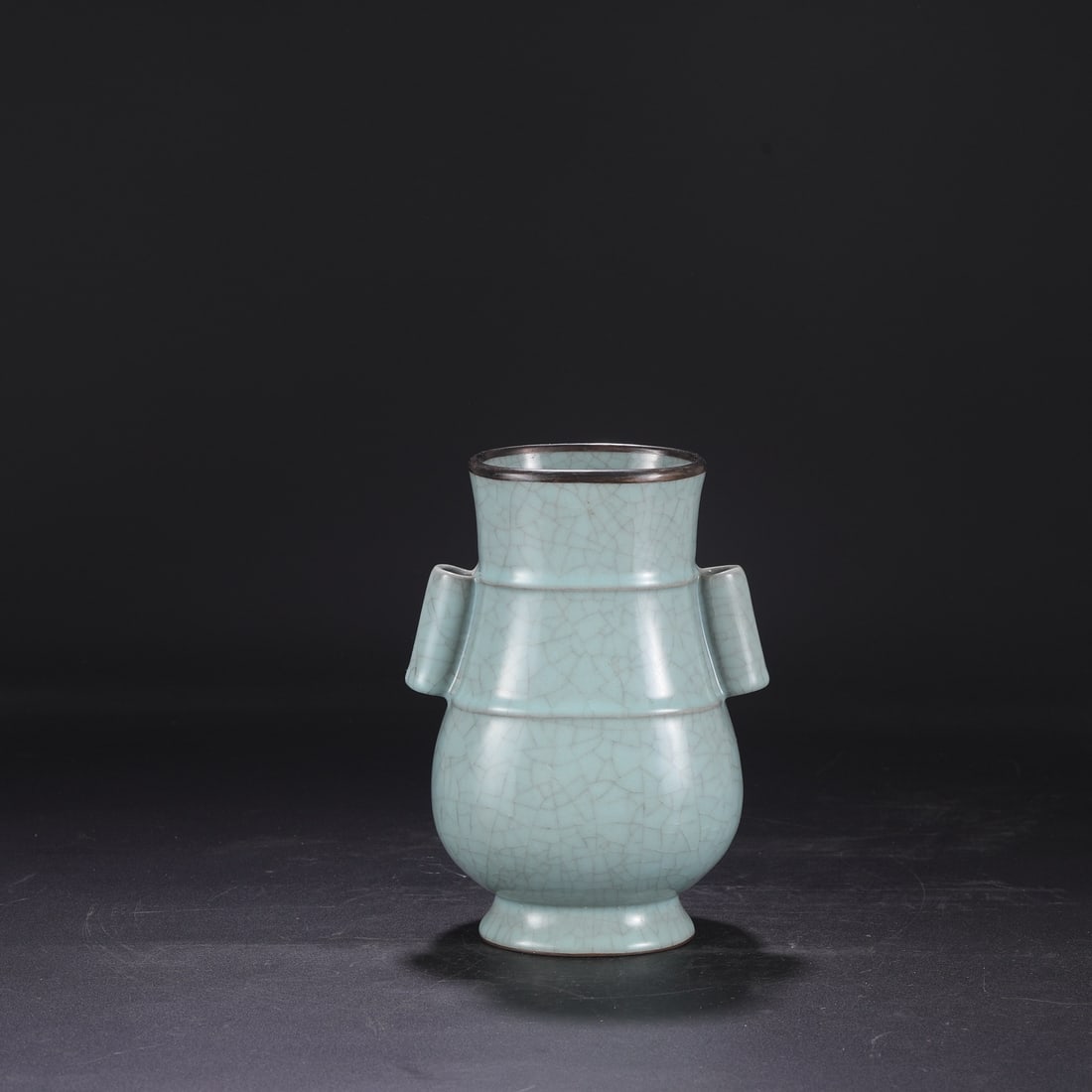 A Southern Song Dynasty official kiln celadon vase with a silver rim, used in the imperial court,: Dimensions: Height 23 cm, Mouth diameter 11 cm, Diameter 16.5 cm.