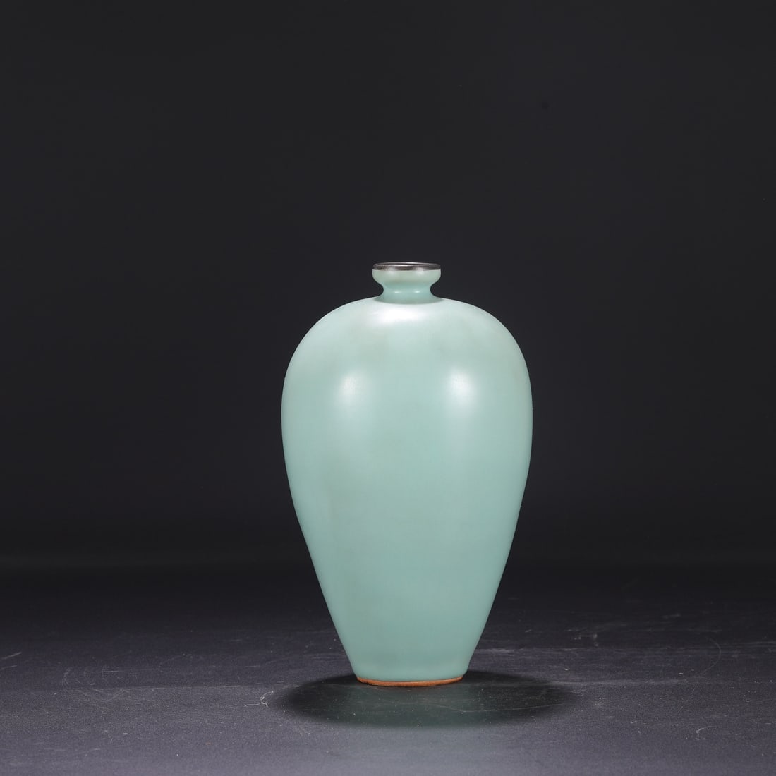 A large Southern Song Dynasty Longquan celadon plum vase with a silver rim, formerly in the: Dimensions: Height 25.5 cm, Mouth diameter 4 cm, Belly diameter 14.5 cm.