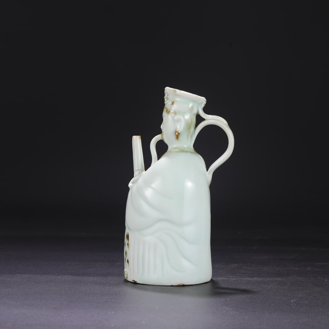 A Southern Song Dynasty Hutian Kiln celadon ewer with painted decoration, featuring a female figure.: Dimensions: Height 23.5 cm, Mouth diameter 4 cm, Diameter 12 cm.