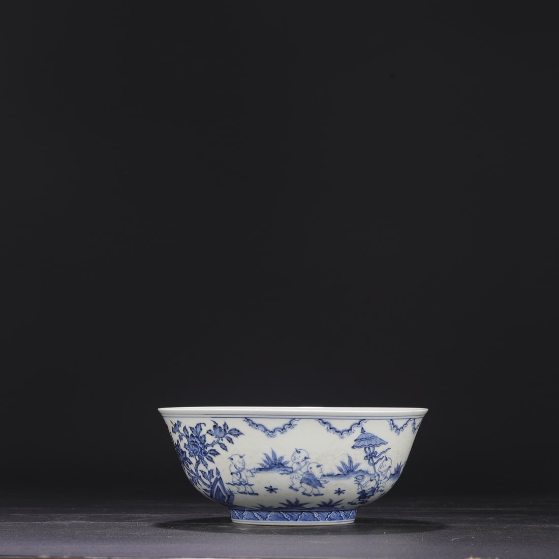 A large, deep-bellied blue-and-white porcelain bowl from the Chenghua period of the Ming dynasty, (1 of 8)