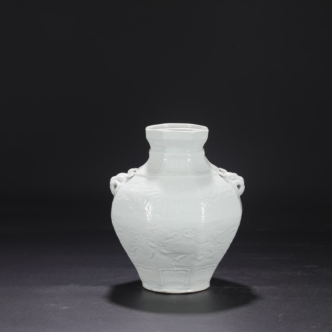 A Yuan Dynasty Shufu kiln egg-white glazed jar with lion, embroidered ball, phoenix, and dog-head: Dimensions: Height 24.5 cm, Mouth diameter 9 cm, Diameter 19.5 cm.