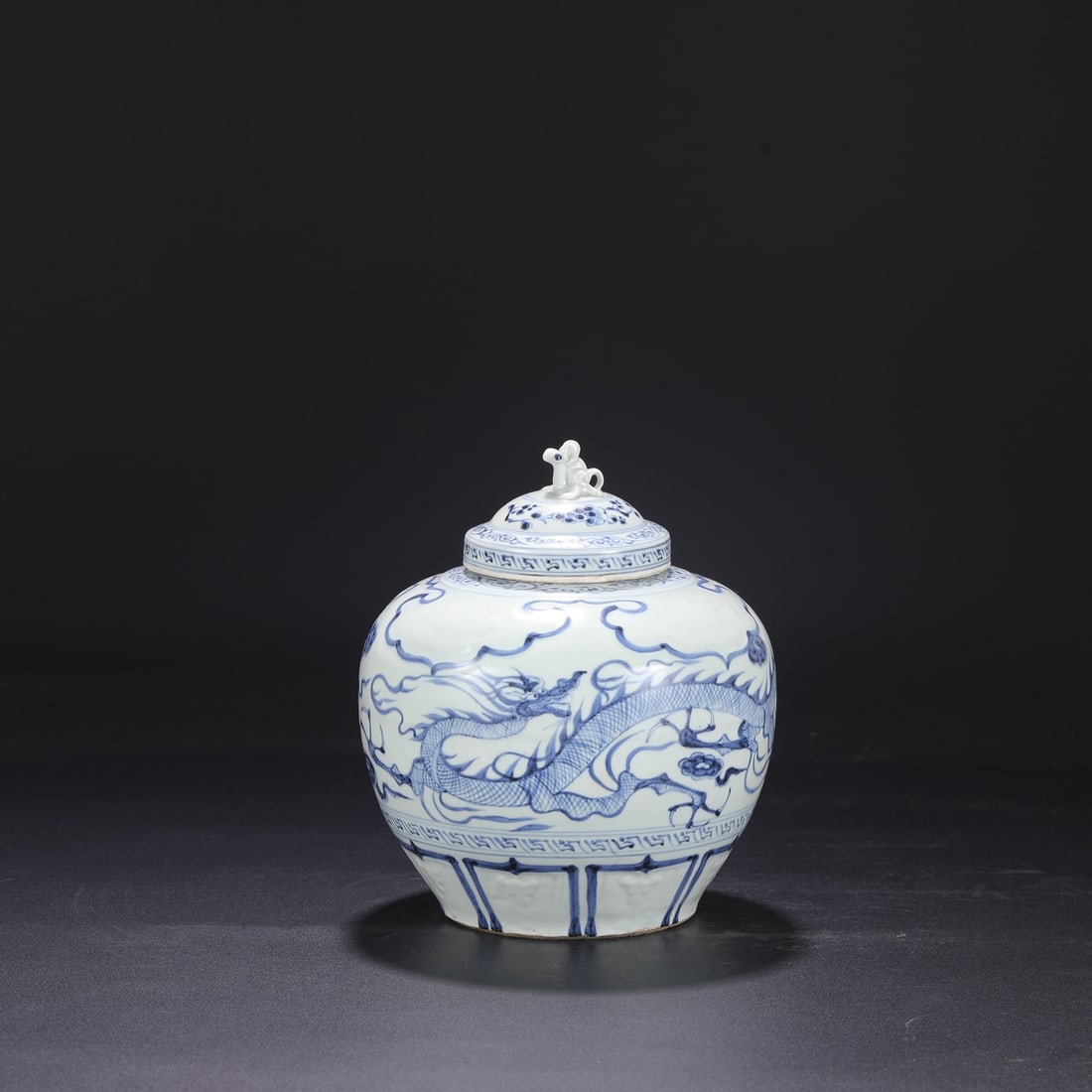A Yuan Dynasty blue-and-white porcelain covered jar with cloud, dragon, and phoenix design, formerly (1 of 8)