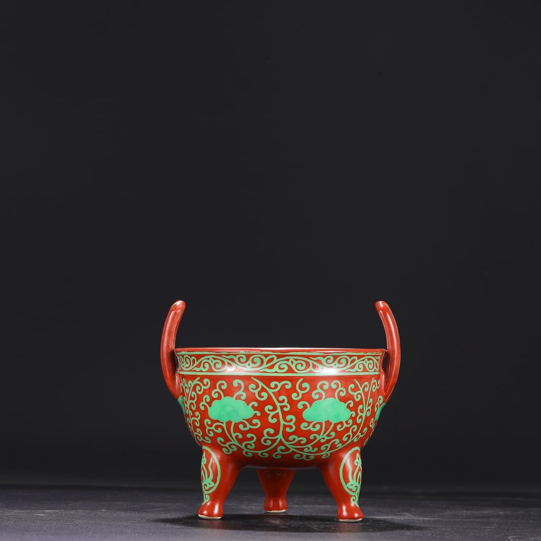 A Ming Dynasty Chenghua period red-ground green-enamel lingzhi-patterned tripod incense burner,: Dimensions: Height 15.5 cm, Mouth Diameter 15 cm.