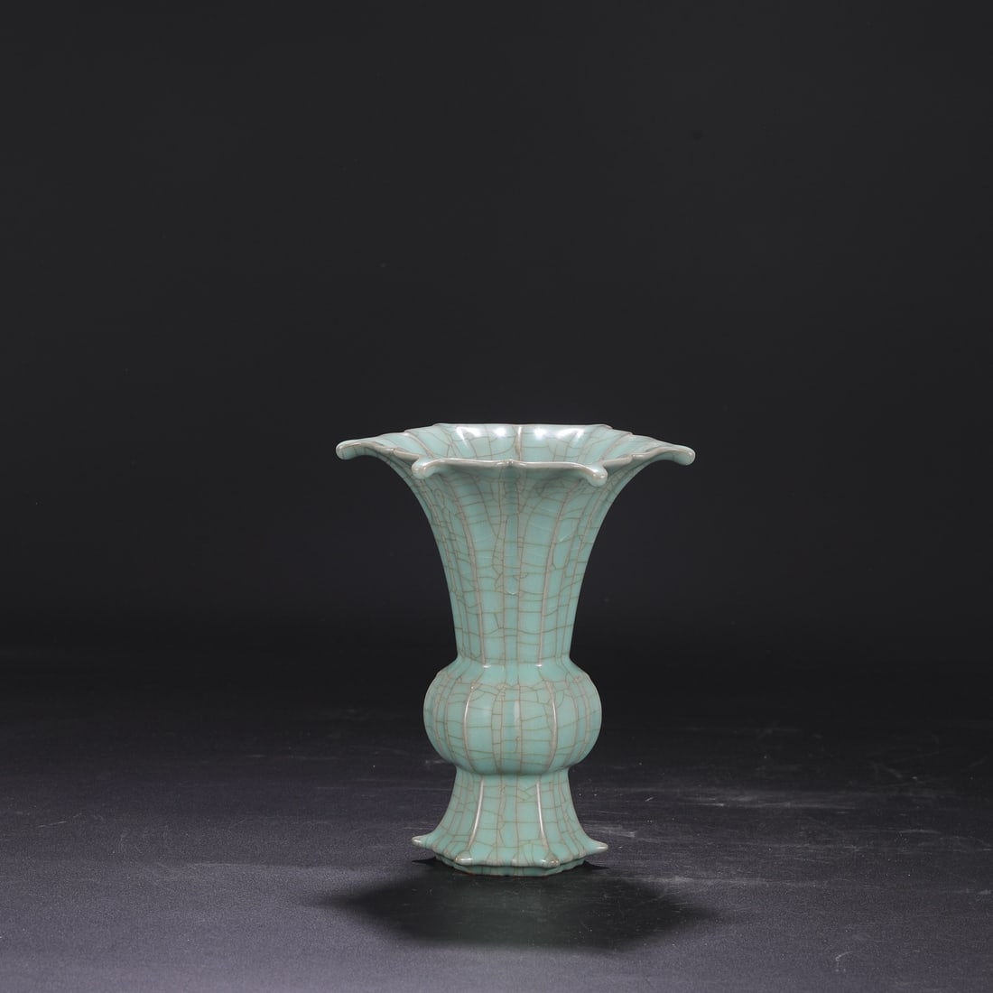 A Southern Song Dynasty official kiln celadon-glazed imperial melon-shaped floral ornament, formerly (1 of 7)