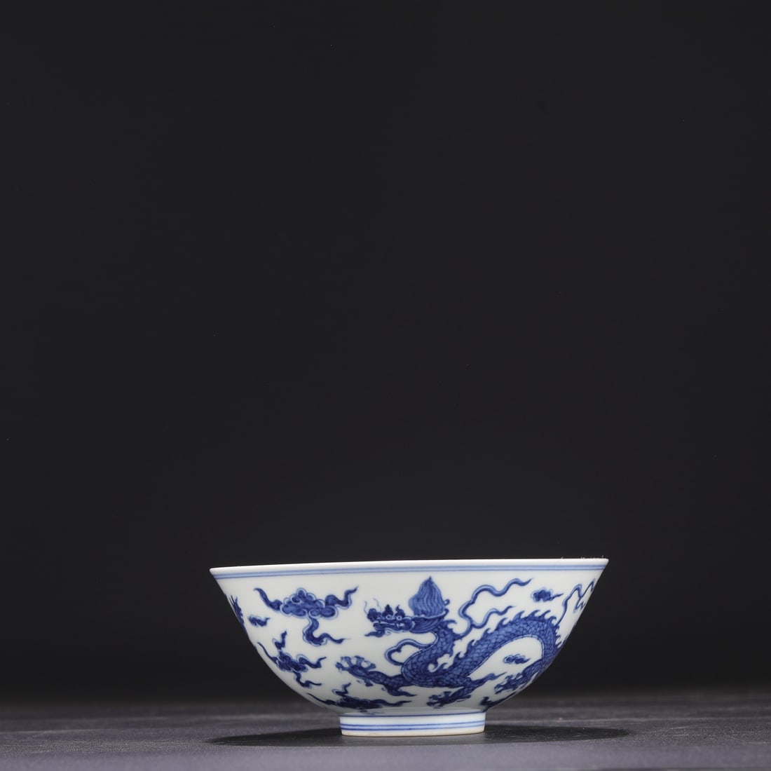 A Ming Dynasty Chenghua blue and white porcelain palace bowl with dragon and cloud design, formerly (1 of 7)