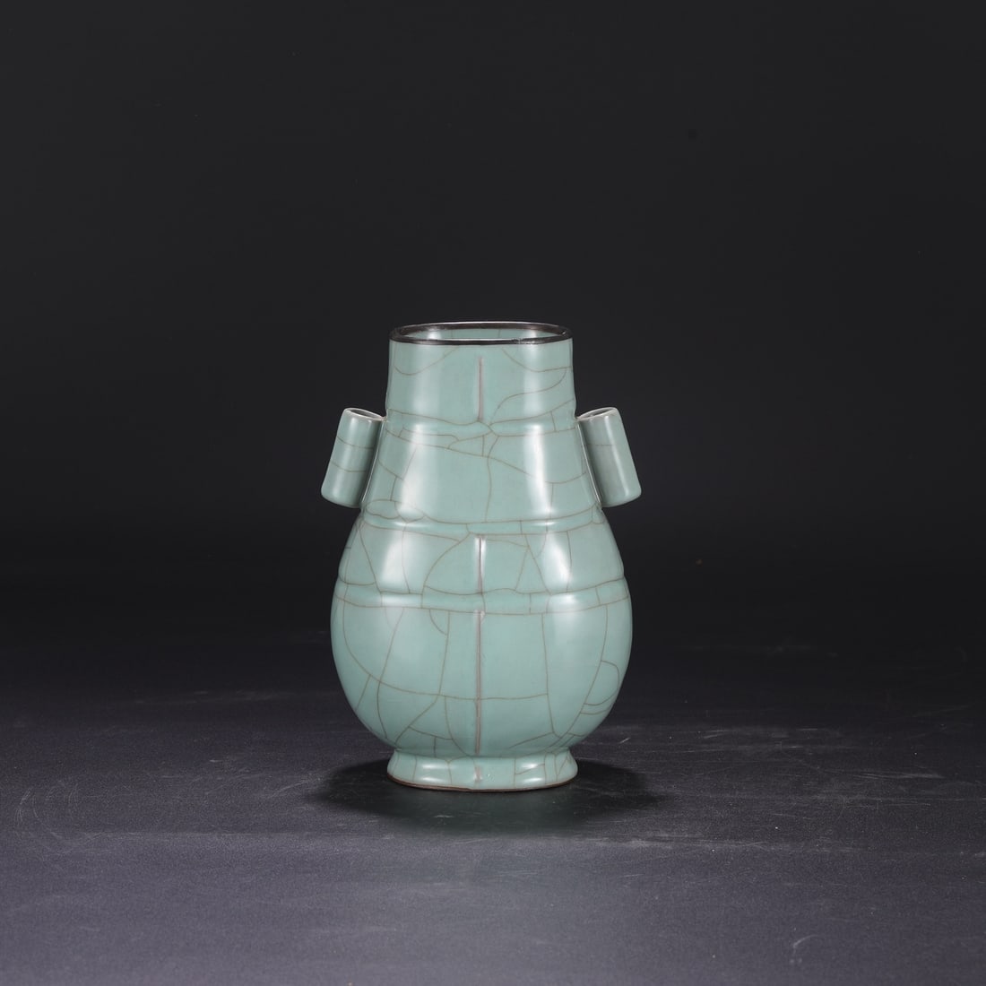 A Southern Song Dynasty official kiln celadon vase with a silver rim, used in the imperial court,: Dimensions: Height 22.5 cm, Mouth diameter 8.5 cm, Belly diameter 14 cm.
