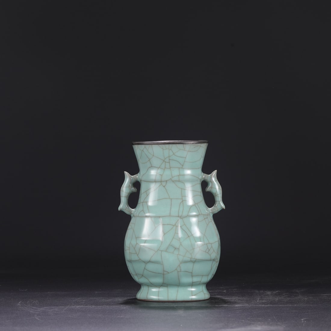 A Southern Song Dynasty official kiln celadon vase with a silver rim, used in the imperial court,: Dimensions: Height 22 cm, Mouth diameter 10 cm, Diameter 14 cm.