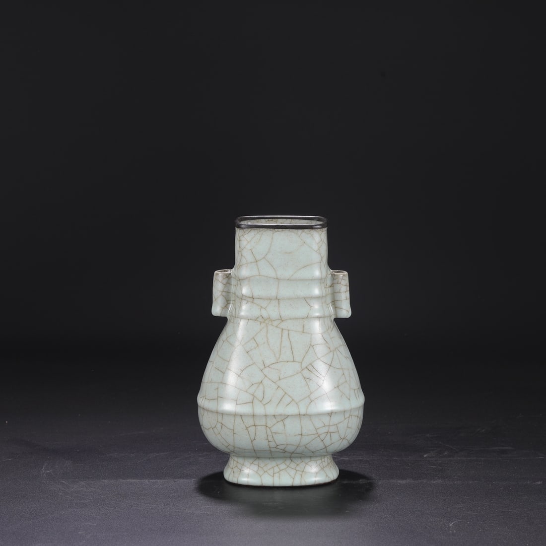A Southern Song Dynasty official kiln celadon vase with a silver rim, used in the imperial court,: Dimensions: Height 24.5 cm, Mouth diameter 8 cm, Belly diameter 14.5 cm.