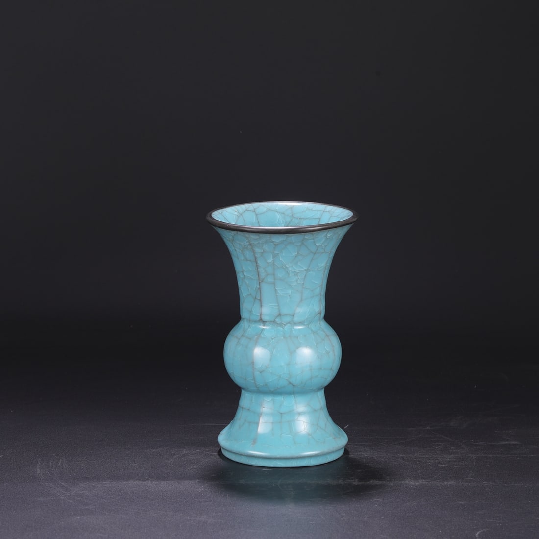 A Northern Song Dynasty Ru ware sky-blue glazed vase with ice-crack pattern and silver rim, used in: Dimensions: Height 23 cm, Mouth Diameter 14 cm.