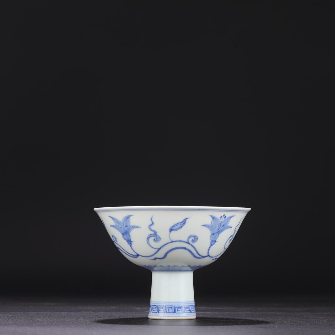 A Ming Dynasty Chenghua blue-and-white floral-patterned stem bowl, formerly in the collection. (1 of 7)