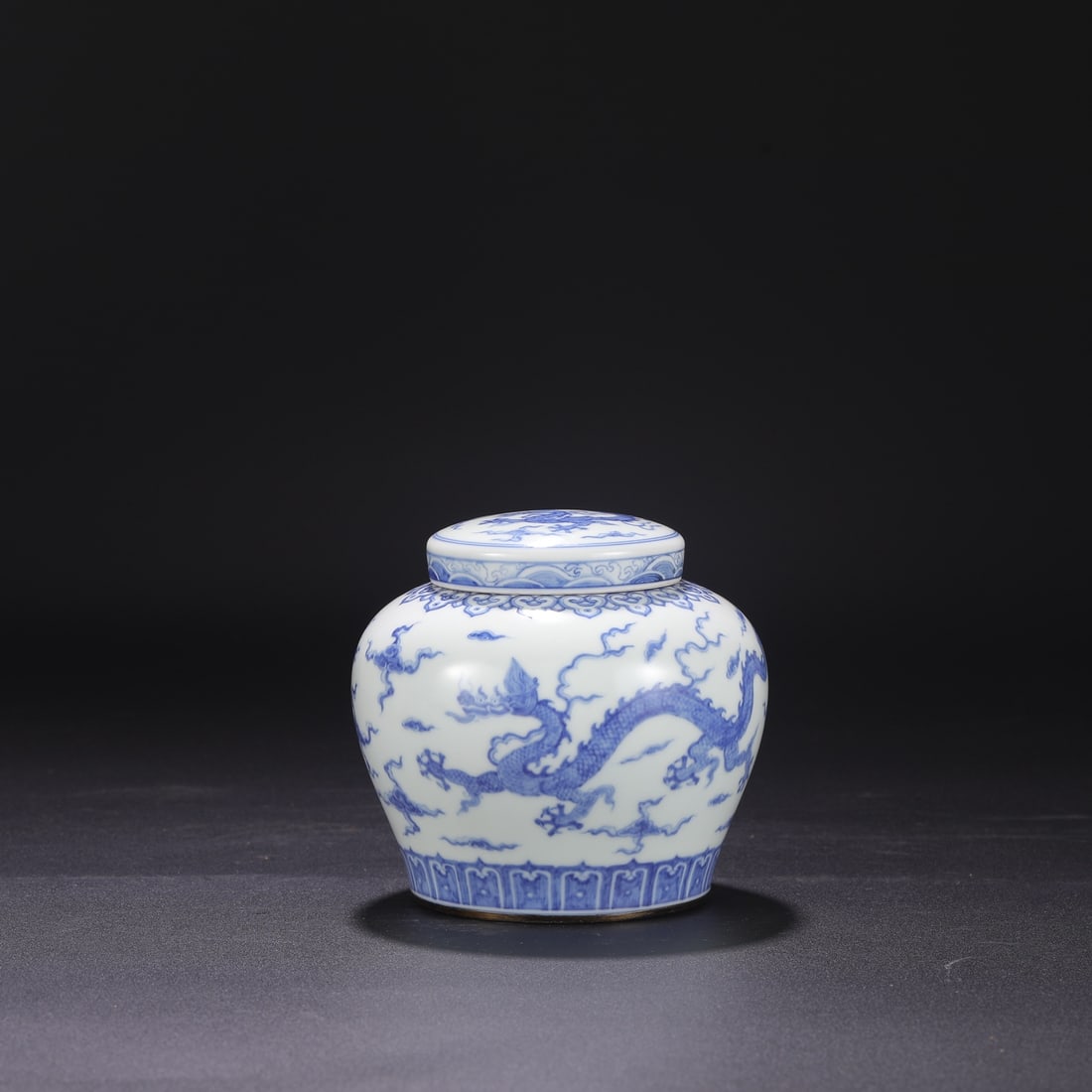 Formerly in the collection, a Ming Dynasty Chenghua blue and white porcelain jar with a dragon and: height, 7 cm in mouth diameter, and 14 cm in belly diameter.measuring 13 cm in height, 7 cm in mouth diameter, and 14 cm in belly diameter.