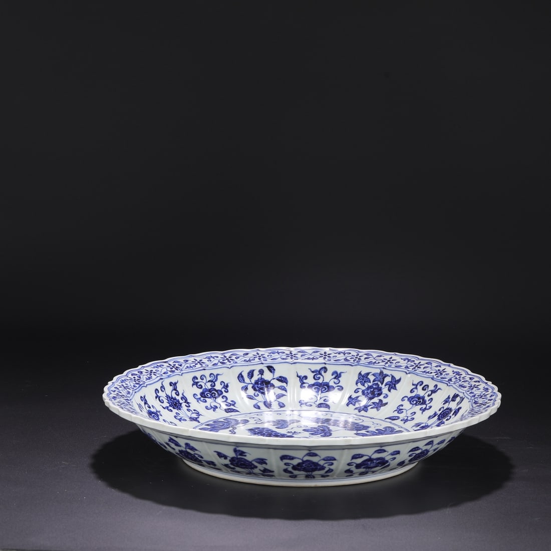 Formerly in the collection, Ming Dynasty Yongle blue and white porcelain melon-shaped plate with (1 of 8)