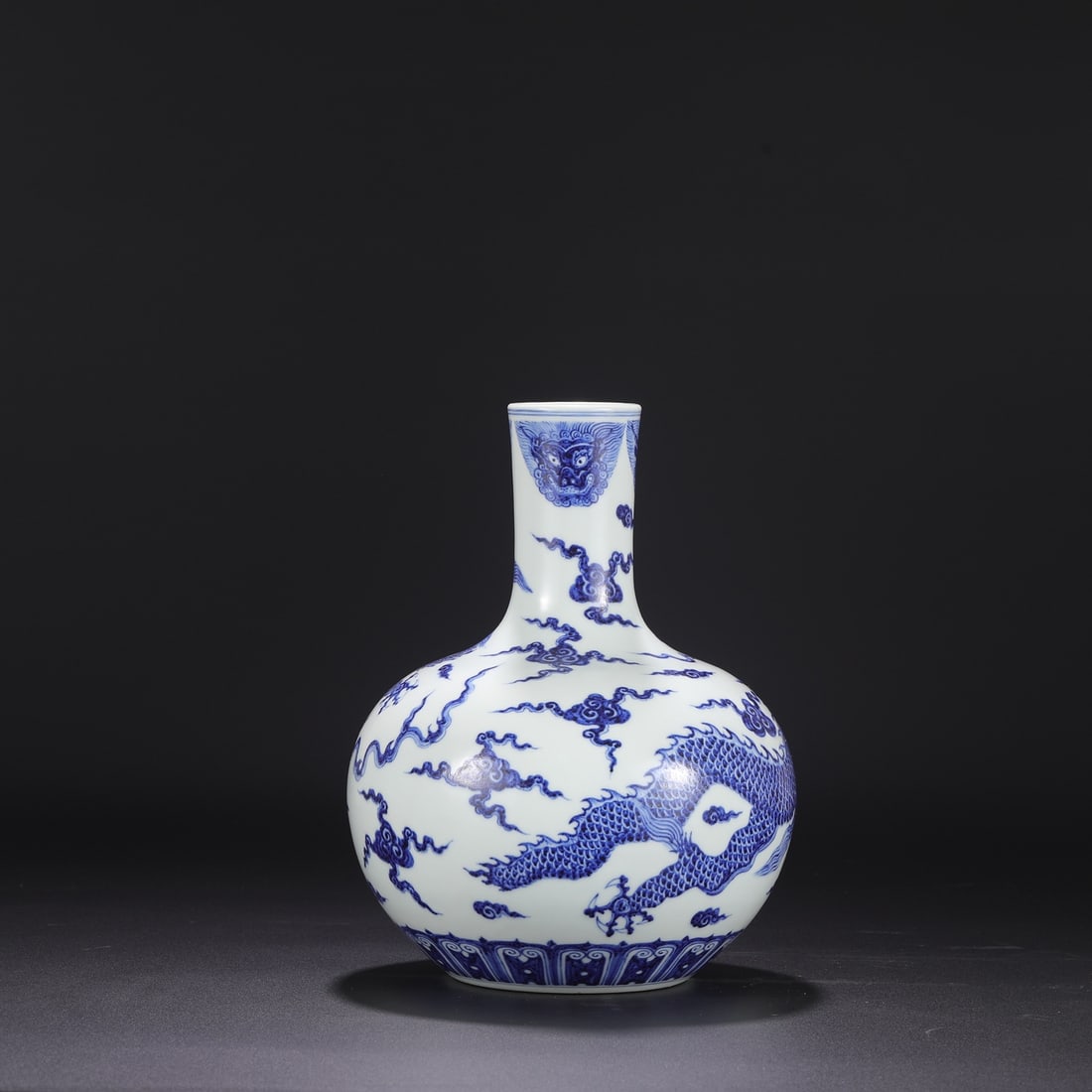 A large blue-and-white porcelain vase with taotie and cloud dragon design from the Xuande period of (1 of 7)