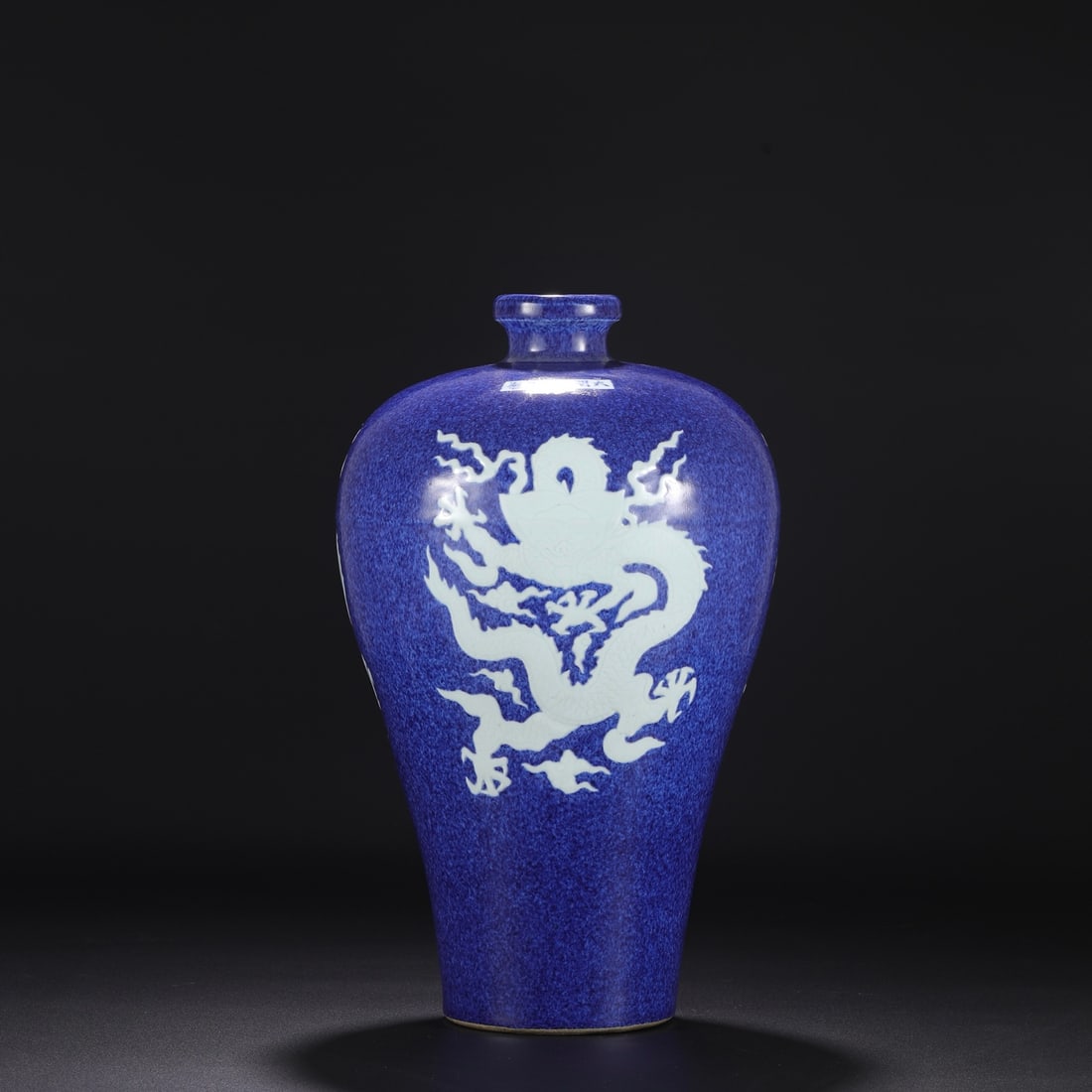 A large plum vase from the Xuande period of the Ming dynasty, with a blue-glazed, openwork design: Dimensions: Height 43 cm, Mouth diameter 5 cm, Belly diameter 25 cm.