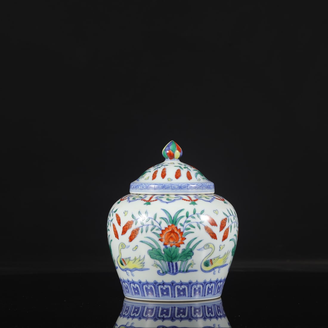 A Ming Dynasty Chenghua period doucai (enamel overglaze) covered jar with duck and lotus pond design: Dimensions: Height 18 cm, Mouth diameter 8 cm, Belly diameter 14.5 cm.