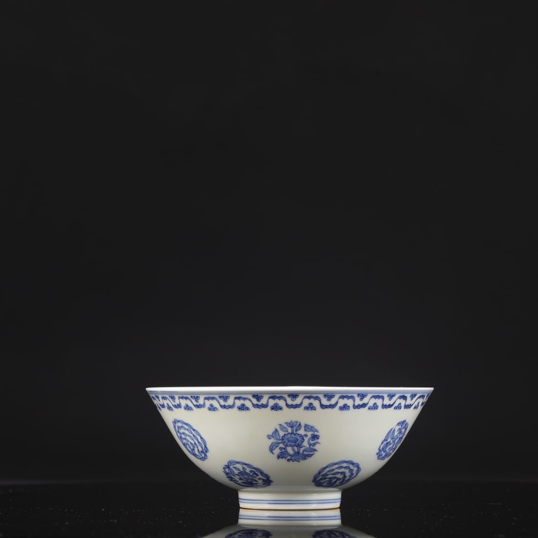 A Ming Dynasty Chenghua blue-and-white porcelain palace bowl with floral medallion, formerly in the (1 of 7)