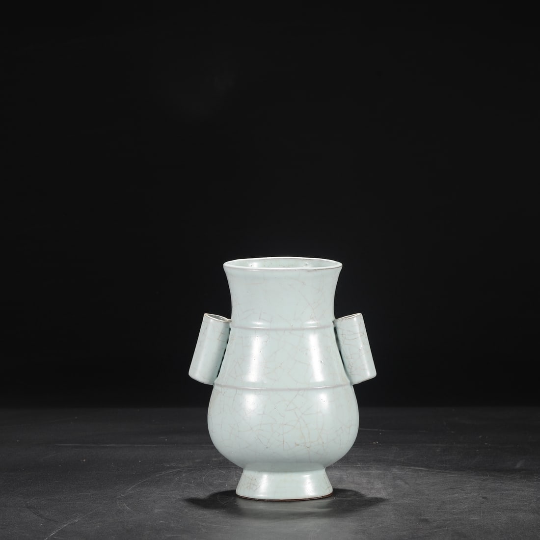 A large Southern Song Dynasty official kiln celadon vase with tubular handles, formerly in the (1 of 8)