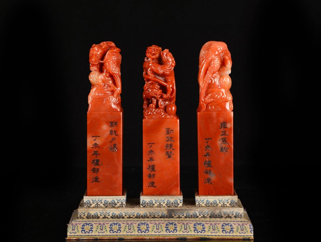 A set of three Shoushan red Tian stone seals, formerly from the Yongzheng period of the Qing (1 of 8)