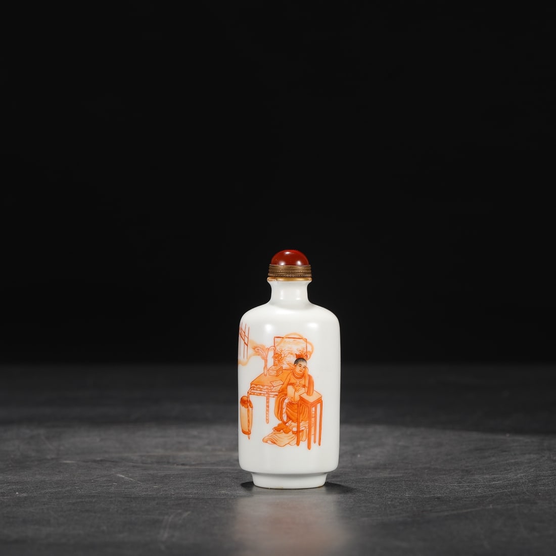 A Qing Dynasty Kangxi period snuff bottle with an inscription in iron-red enamel, formerly in the (1 of 7)