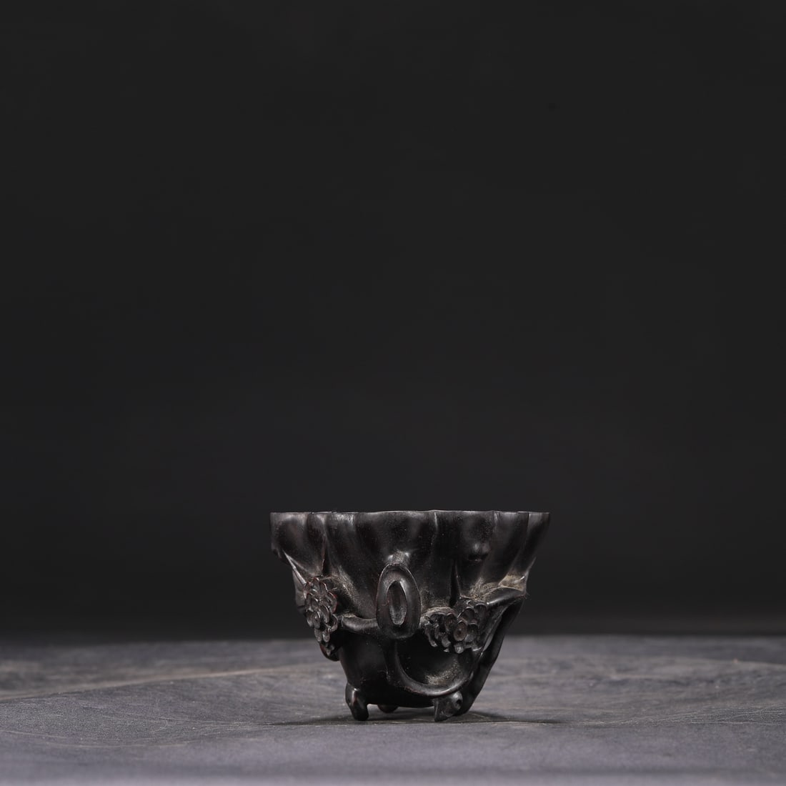 A Qing Dynasty Qianlong period small-leaf sandalwood ear cup, formerly in the collection.: Dimensions: Height 7.5 cm, Mouth diameter 11.5 cm, Overall diameter 13 cm.