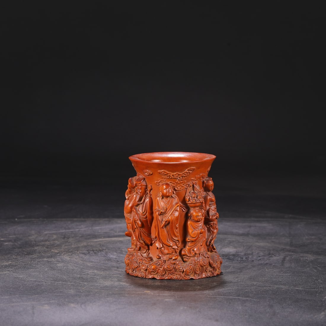 A Qing Dynasty Qianlong period boxwood brush pot carved with the Eight Immortals Crossing the Sea.: Dimensions: Height 11.5 cm, Mouth Diameter 8.5 cm.