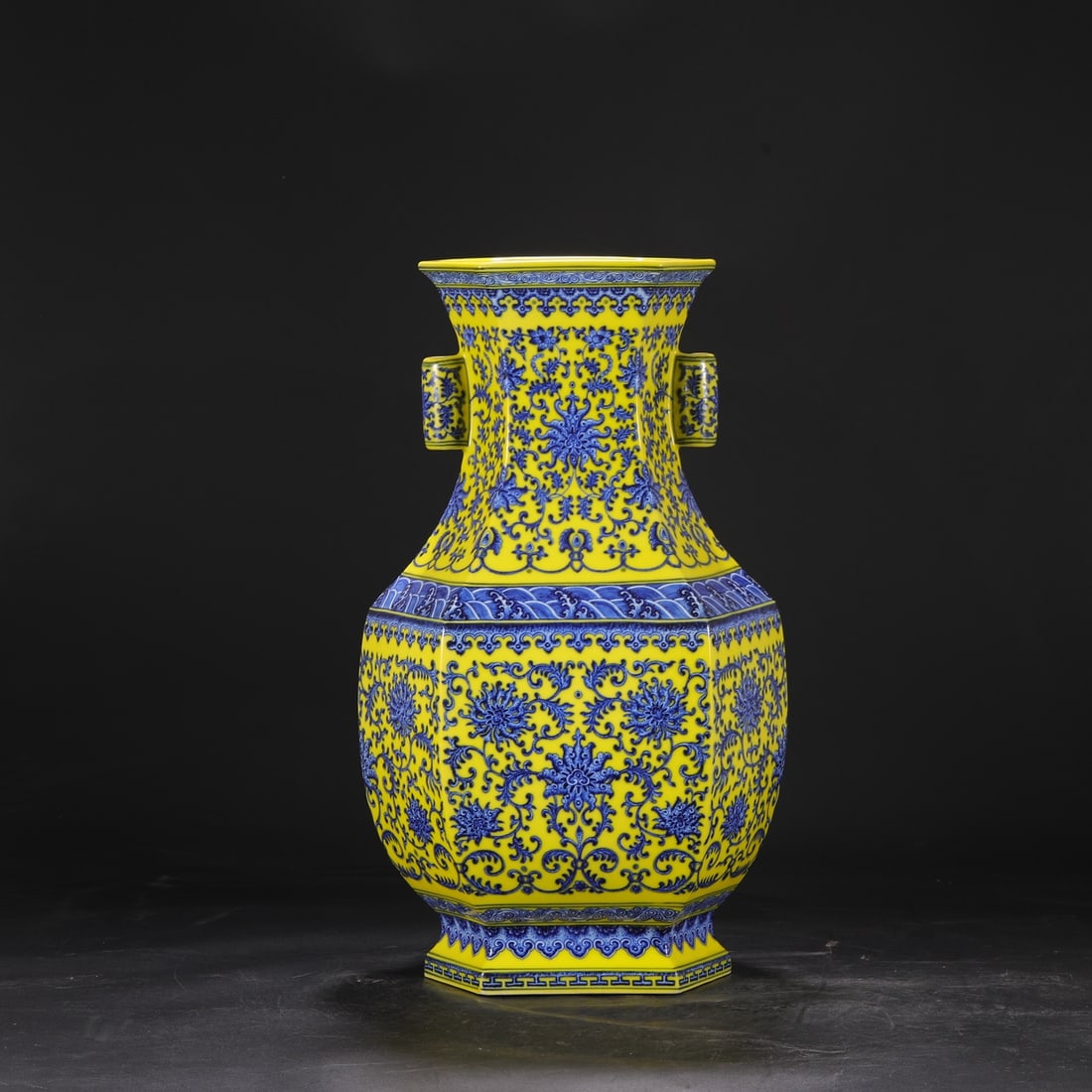 A large, six-sided vase with a yellow ground and blue-and-white design of lotus and wave patterns, (1 of 8)