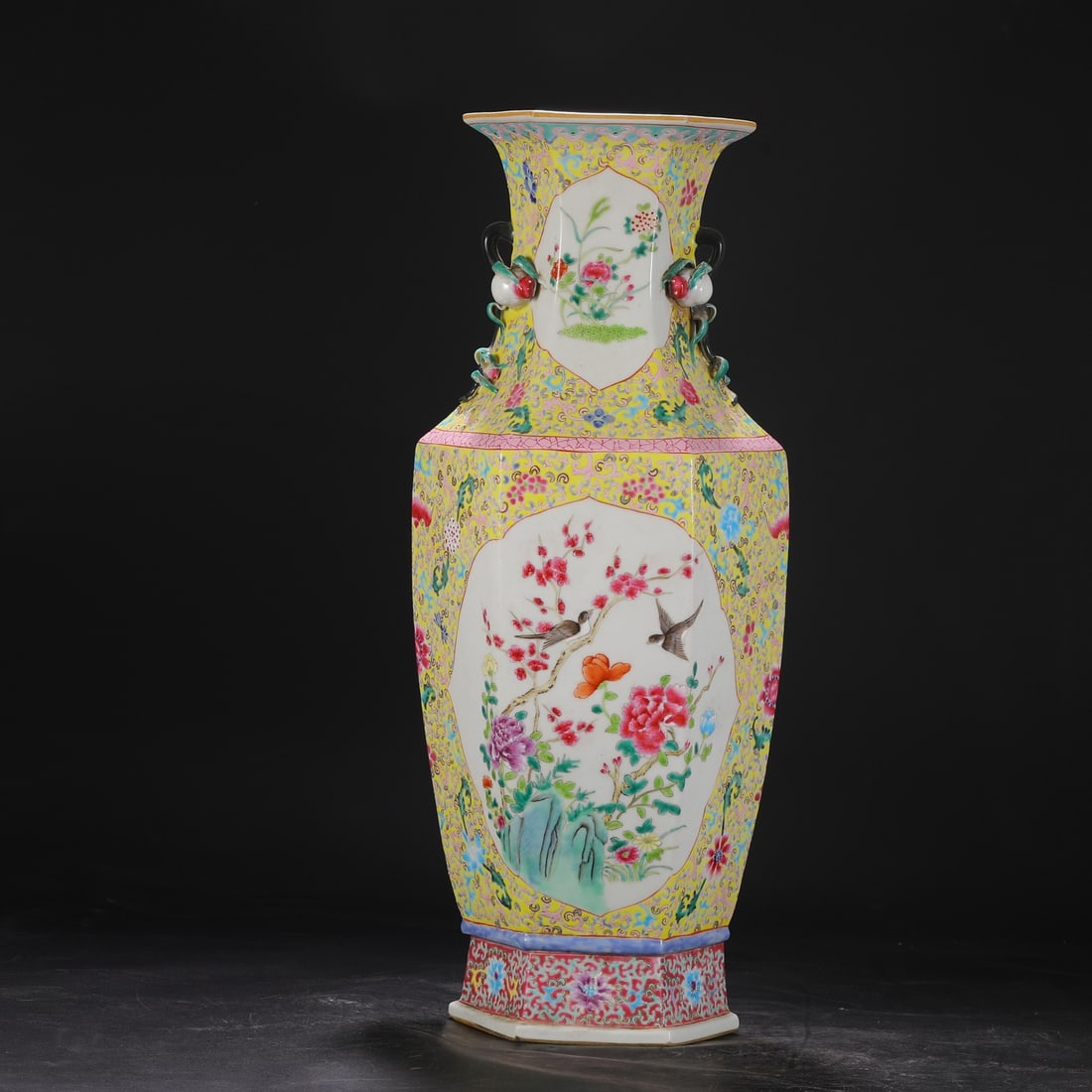 A large, six-sided vase with famille rose enamel decoration of flowers, birds, rocks, peacocks, and (1 of 8)