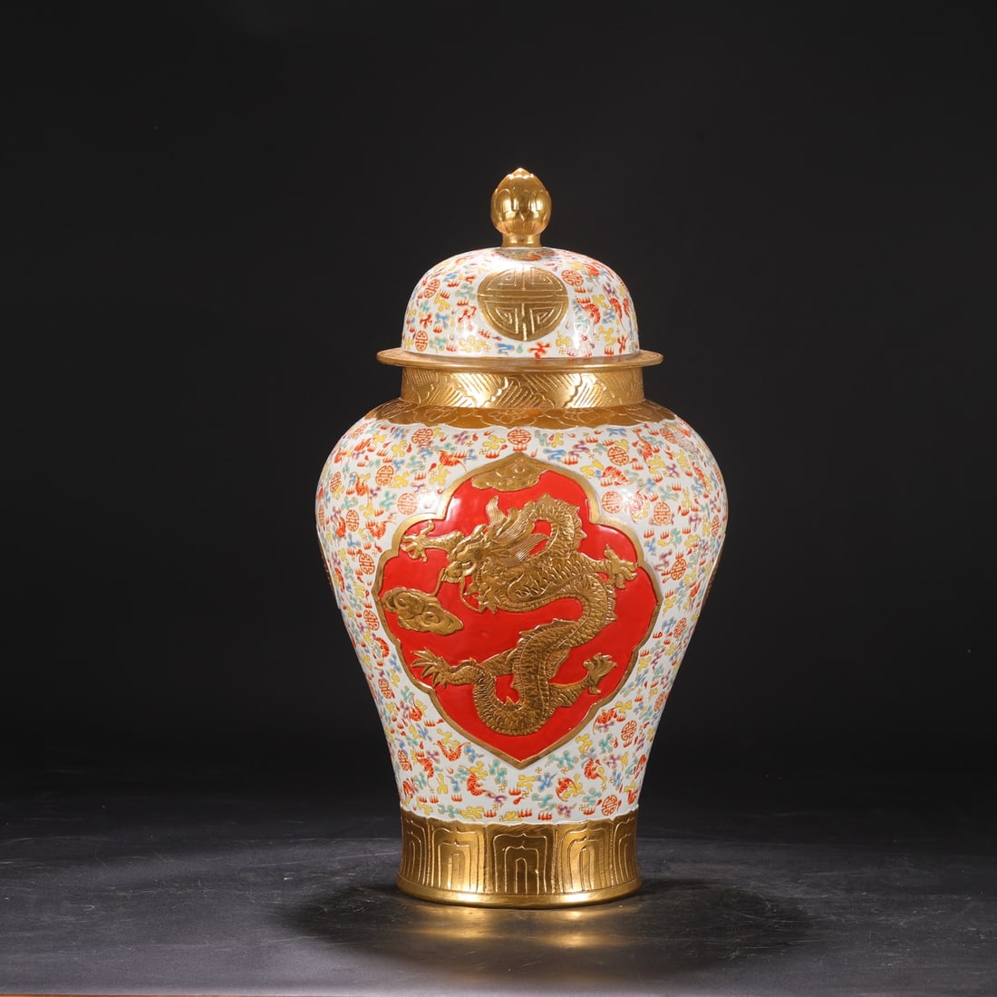 A Qing Dynasty Qianlong period enamel-painted jar with a gilt dragon design and openwork design. (1 of 7)