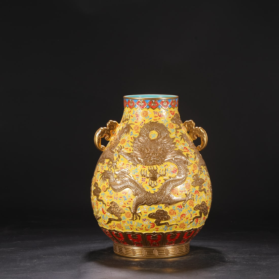 A large Qing Dynasty Qianlong period enamel-painted vase with deeply carved cloud and dragon design (1 of 8)