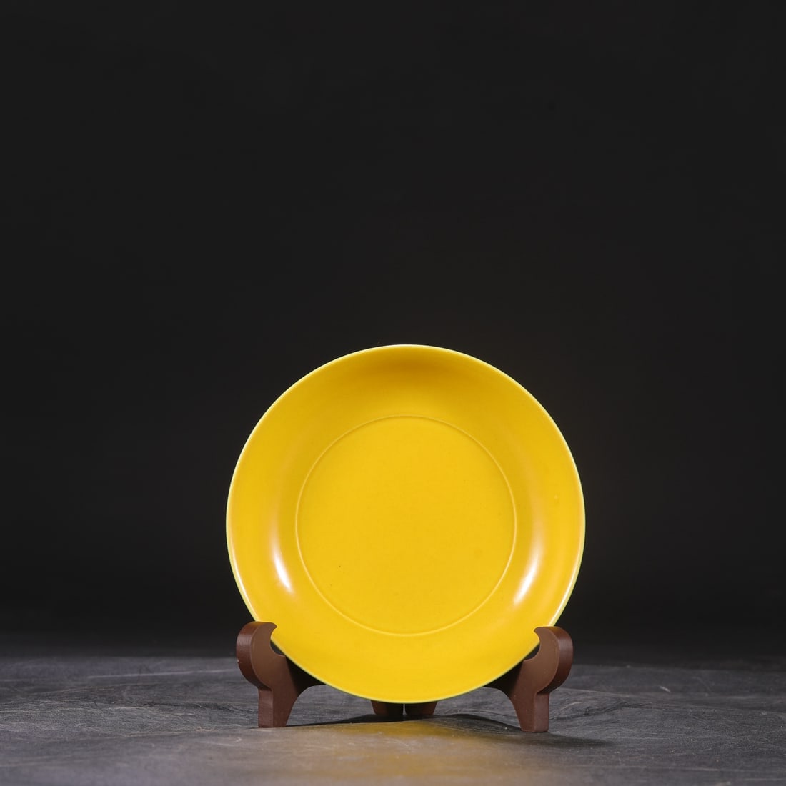 A Ming dynasty Xuande period yellow-ground green-enamel plate, formerly in the collection. (1 of 6)