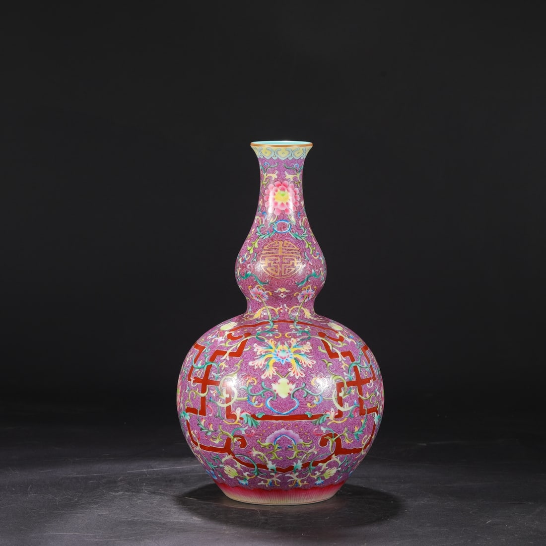 A large gourd-shaped vase with enamel decoration on a purple ground and scrolling floral design, (1 of 8)