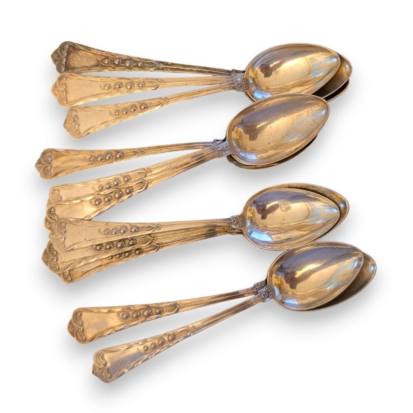 Swiss 20th century Set of 11 "Lily of the Valley" spoons by JEZLER: Set of twelve "Lily of the Valley" teaspoons by JEZLER.Net weight 220gOrigin: SwitzerlandPeriod: 20th centuryMaterials: SilverDimensions: Ht 14 x 3 x 2 cm