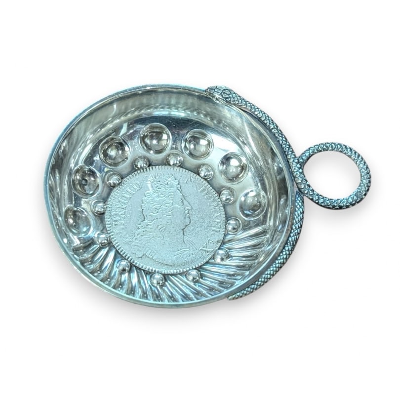 French Silver wine taster, 1703 piece: Silver Tastevin, coin depicting Louis XIV dated 1703Origin: FrancePeriod: 19th centuryMaterials: SilverDimensions: Ht 2.5 x 11 x 8.5 cm