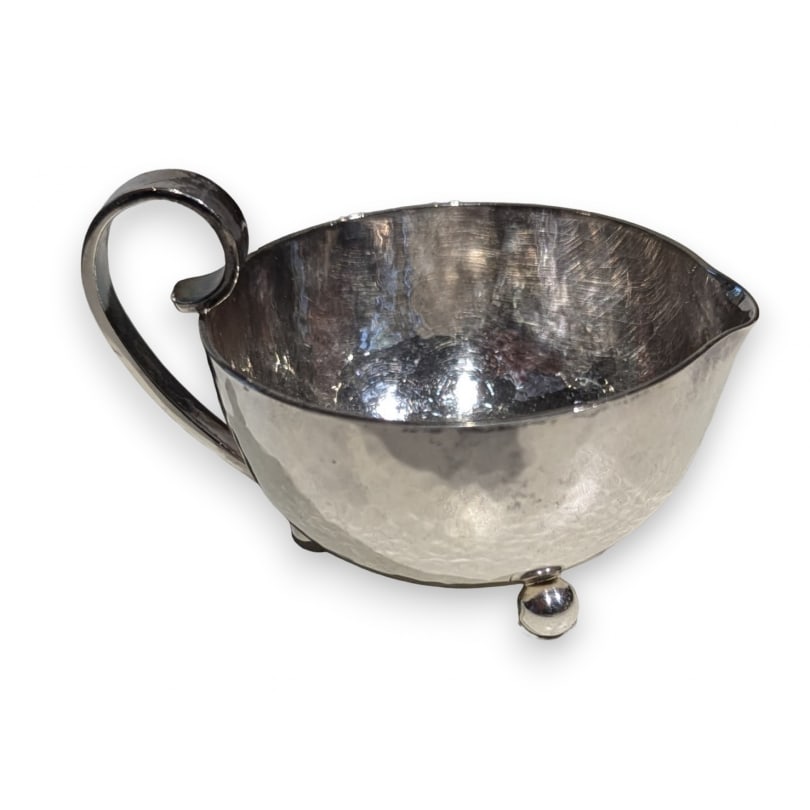 Swiss 20th century Jezler hammered silver cream pot: Jezler hammered silver cream pot 239671gOrigin: SwitzerlandPeriod: 20th centuryMaterials: SilverDimensions: Ht 5.5 x 8.5 x 6.5 cm