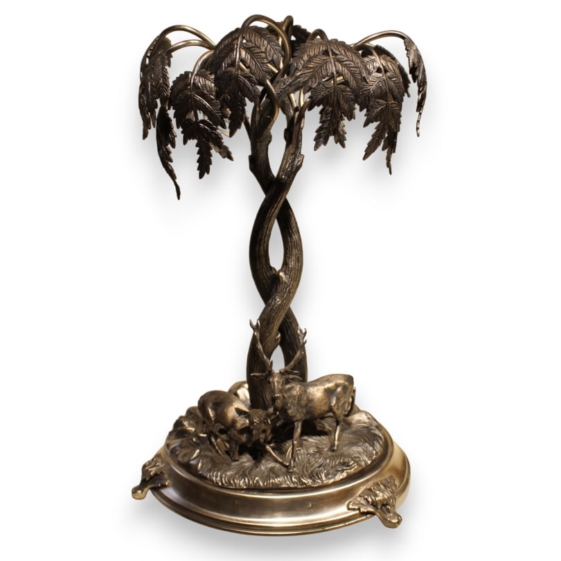 Silver metal centerpiece by Henniger & Co: Silver-plated metal centerpiece by Henniger & Co depicting a tree with a stag and a doeOrigin: GermanyPeriod: 20th centuryMaterials: Silver-plated metalDimensions: Height 40 x Diameter 25 cm