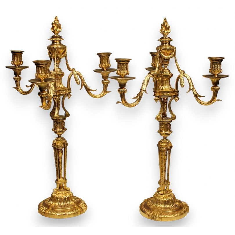 French Late 19th century Pair of Louis XVI style girandoles: Pair of French Louis XVI style three-light girandoles, in gilt and chased bronze. Decorated with cassolettes. Paris.Origin: FrancePeriod: Late 19th centuryMaterials: Chiseled bronze - Gilded bronzeDim