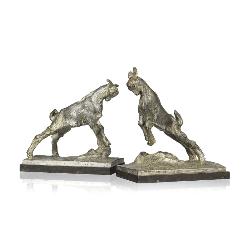 Pair of signed bookends depicting facing kids: Pair of bronze bookends depicting facing kids with a silver patina, signed on the bases J. DA SILVA (Joao 1880-1960) and bearing the foundry marks of Colin in ParisOrigin: FrancePeriod: 20th centuryMa