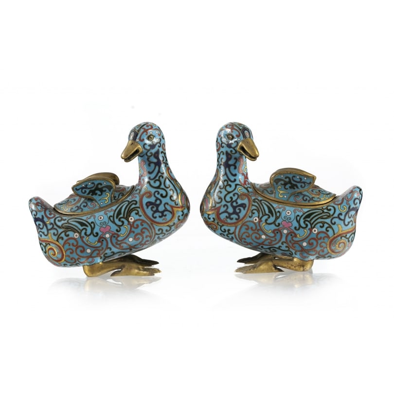 Antique Chinese Pair of cloisonné duck-shaped incense burners: Pair of ducks forming incense burners in cloisonné enamel, bodies decorated with scrolling foliageOrigin: ChinaPeriod: Early 20th centuryMaterials: BronzeDimensions: Ht 15.5 x 16 x 9 cm