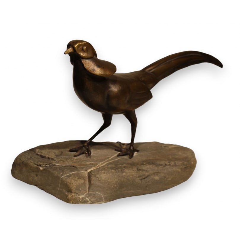 Bronze pheasant on a stone, signed REUSSNER: Bronze pheasant on a stone, signed REUSSNER (Charles 1886-1961)Origin: SwitzerlandPeriod: 20th centuryMaterials: BronzeDimensions: Ht 19 x 35 x 15 cm