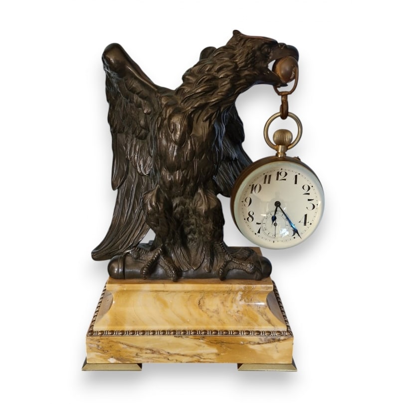French Bronze watch stand decorated with an eagle: Bronze watch stand decorated with an eagle, yellow marble baseOrigin: FrancePeriod: 19th centuryMaterials: BronzeDimensions: Ht 33 x 21 x 13 cm