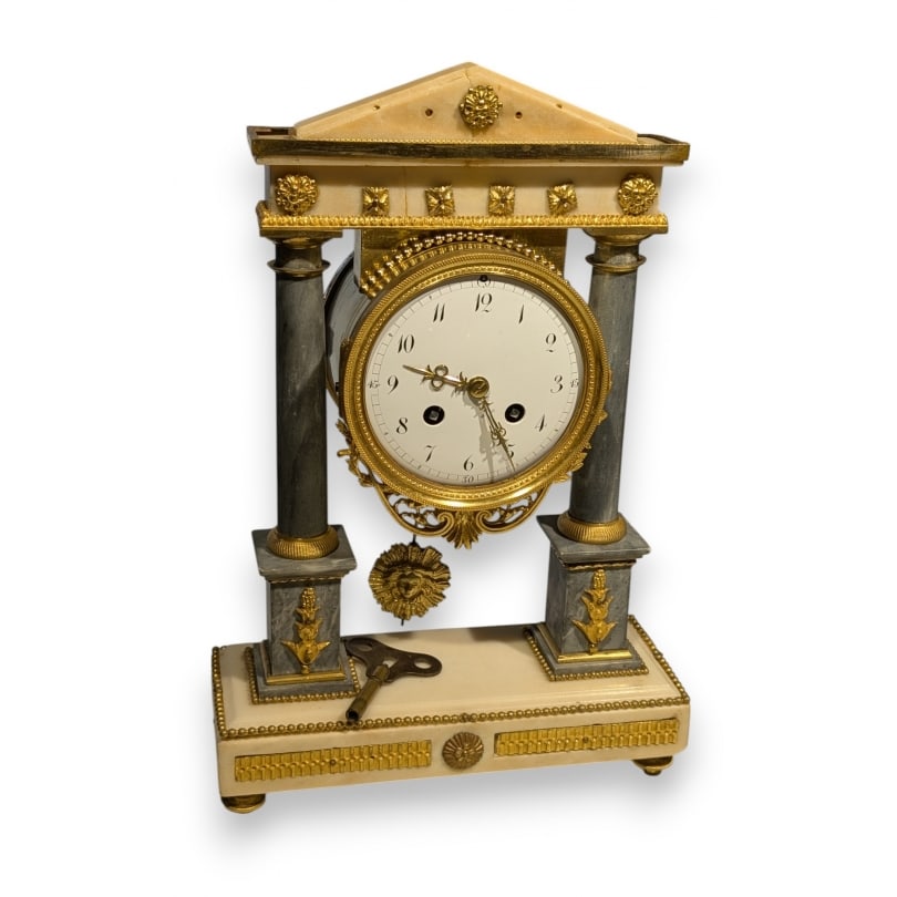 19th century Marble and bronze portico clock: Portico clock in white and gray marble with bronze mountsOrigin: FrancePeriod: 19th centuryMaterials: MarbleDimensions: Ht 37 x 23.5 x 8.5 cm