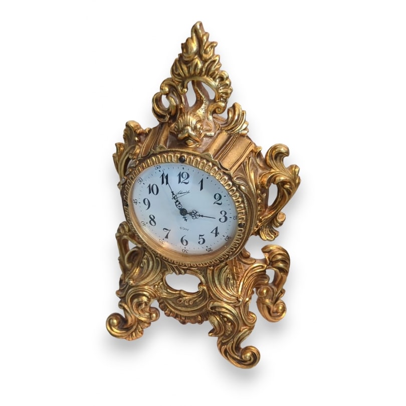 Rococo brass clock by SCHMID: Rococo brass clock by SCHMID, 8-day movementOrigin: GermanyPeriod: 20th centuryMaterials: BrassDimensions: Ht 20 x 13.5 x 6.5 cm