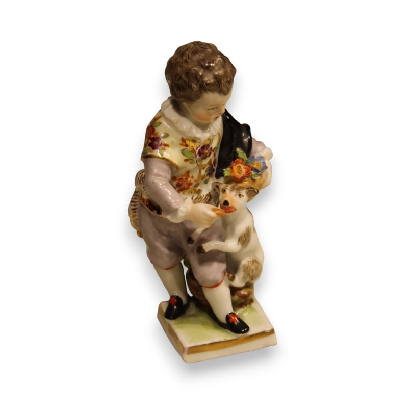 German 19th century Child and dog in Dresden porcelain: Dresden porcelain group "Child and Dog"Origin: GermanyPeriod: 19th centuryMaterials: PorcelainDimensions: Ht 11 x 5 x 6 cm