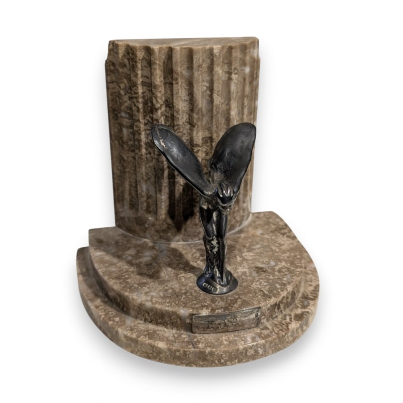 English "Rolls Royce" bookend in silver and marble: Spirit of Ecstasy "Rolls Royce" bookend in silver by Saunders and Shepherd, London, 1937, and beige marbleOrigin: EnglandPeriod: 20th centuryMaterials: SilverDimensions: Ht 12 x 13 x 10 cm